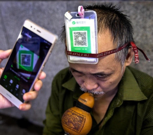 Прогресс не стоит месте: Китайцы платят за всё через смартфон